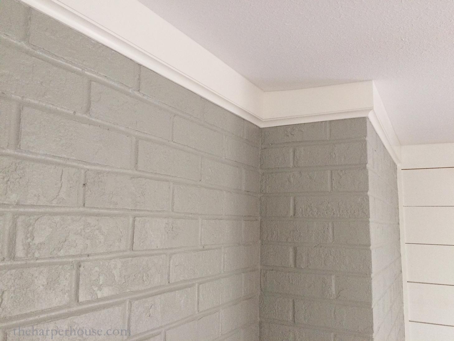 painted brick fireplace makeover with crown molding detail