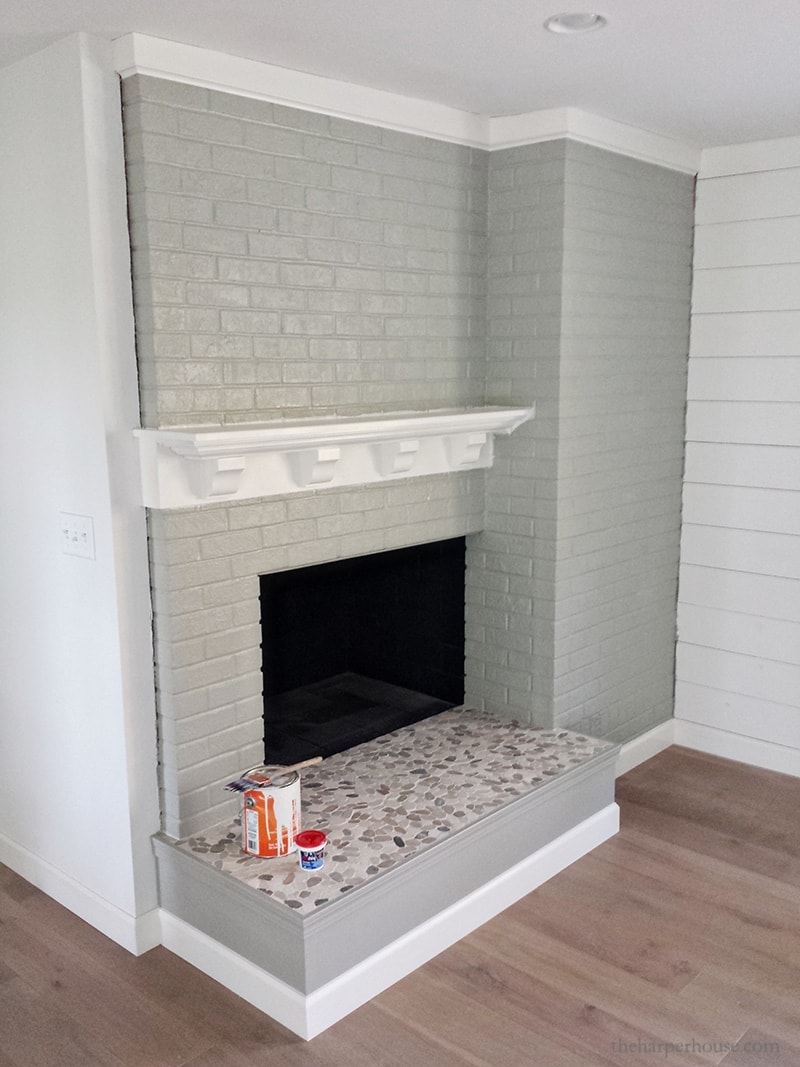 gray brick fireplace with white diy mantel