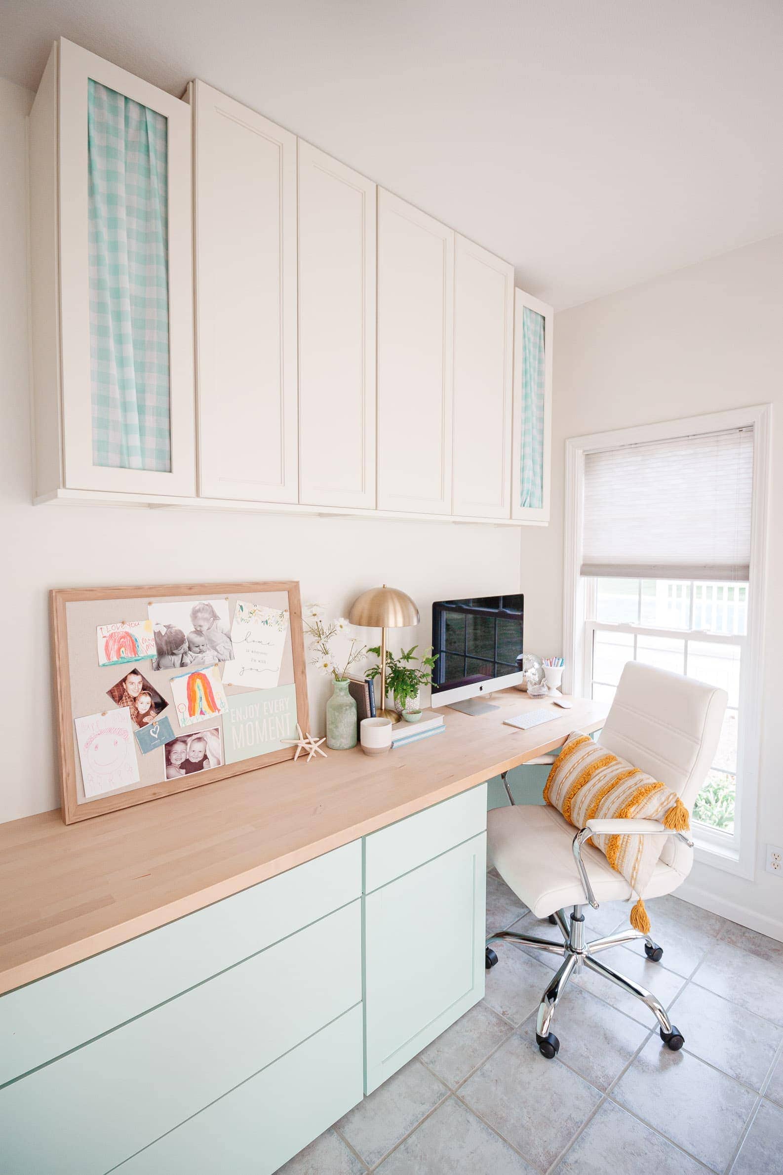 coastal office makeover featuring office decorating ideas and coastal decor. Teal aqua blue desk cabinets and diy butcher block desktop