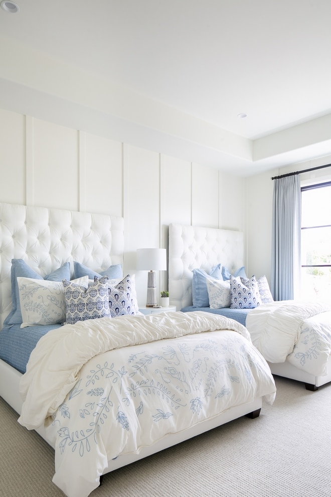 white walls in bedroom with blue accents