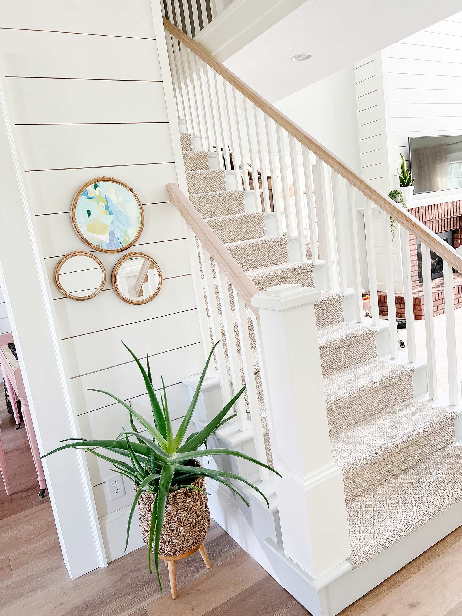 coastal staircase with light and bright white paint